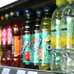 Store shelf displaying sweetened drinks subject to UAE’s new sugar-based excise tax starting in 2026.